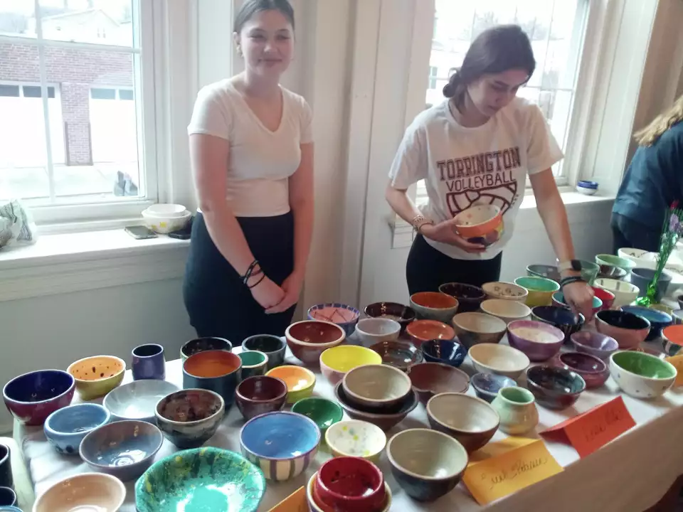 THS Clay Club gets involved in Empty Bowls. The event features handmade ceramic bowls by students homemade soups donated by local restaurants. Pictured from the 2023 event are Kaydan Pease, left, and THS senior Abby Petrie. 

