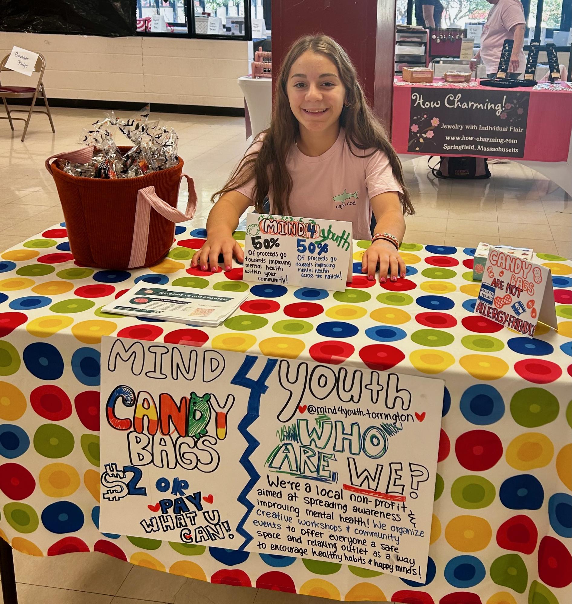 Alina Lopez, a Mind4Youth participant, working the group's informational booth at the Harvest Festival on 10/5.