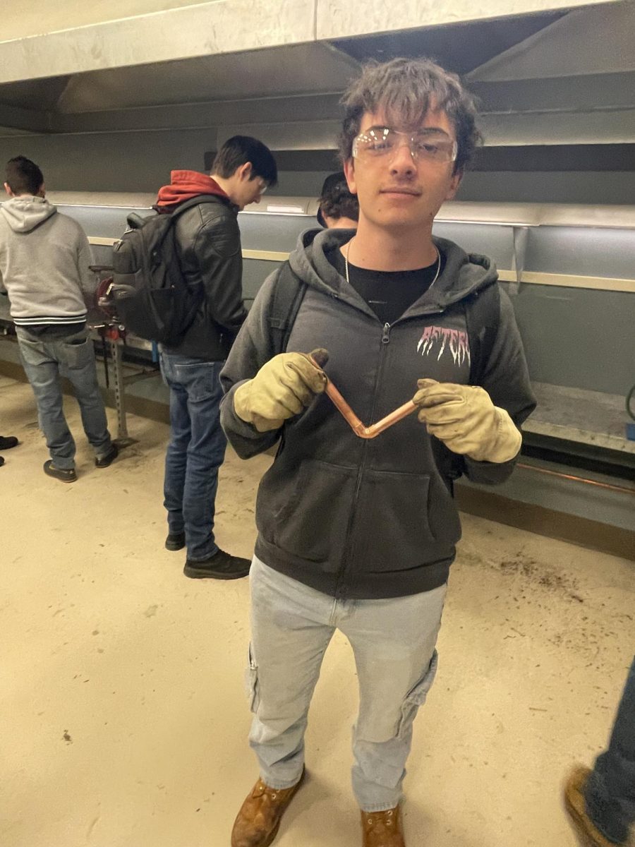Senior Josh Bainer after work in the soldering lab.