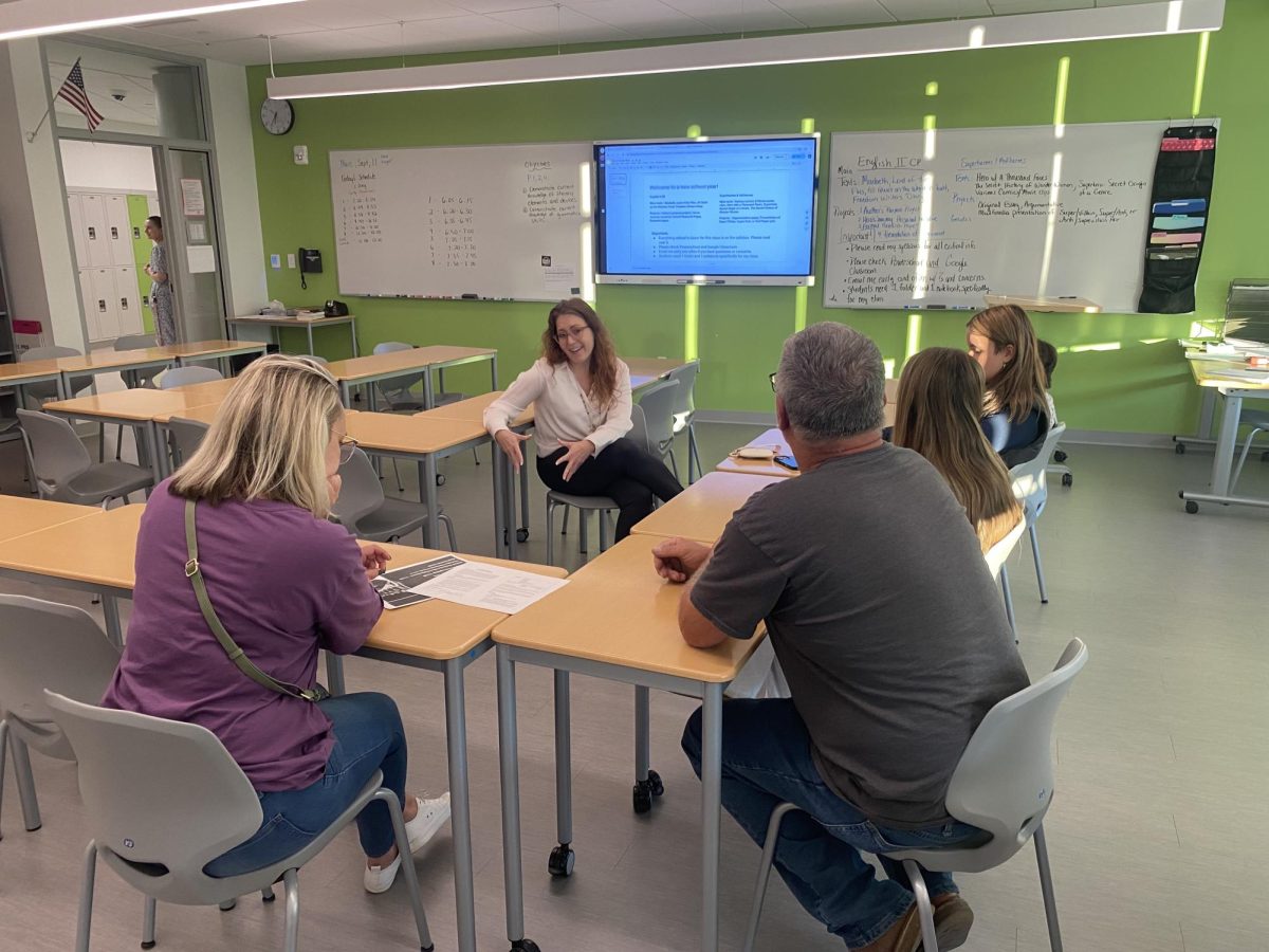 New English Teacher Ms. Helm met with parents of her English II students, introducing them to the course content and expectations.