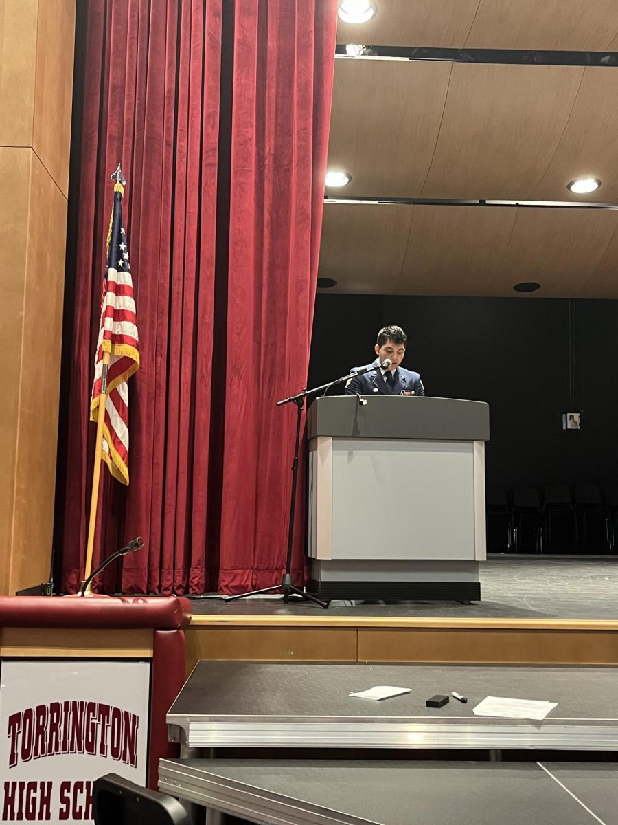 Senior Nic Borja delivering the address at THS's 9/11 ceremony.