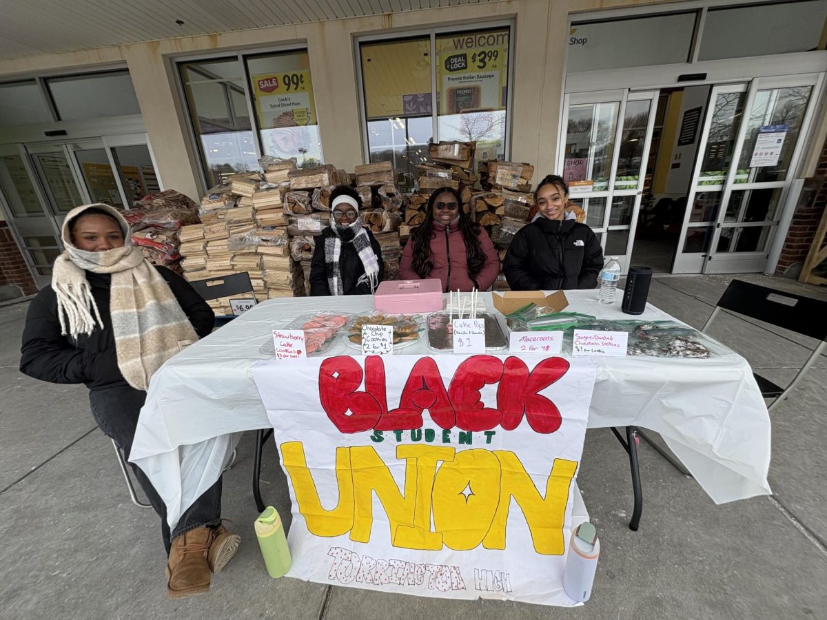 Students of the Black Student Union participating in a bake sale at Stop and Shop.