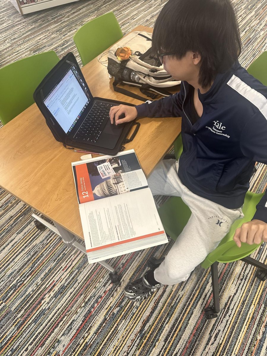 Senior Matt Tsai studying for AP Government. Tsai, who was accepted at Harvard University next year, is leaving THS with more than 50 college credits.